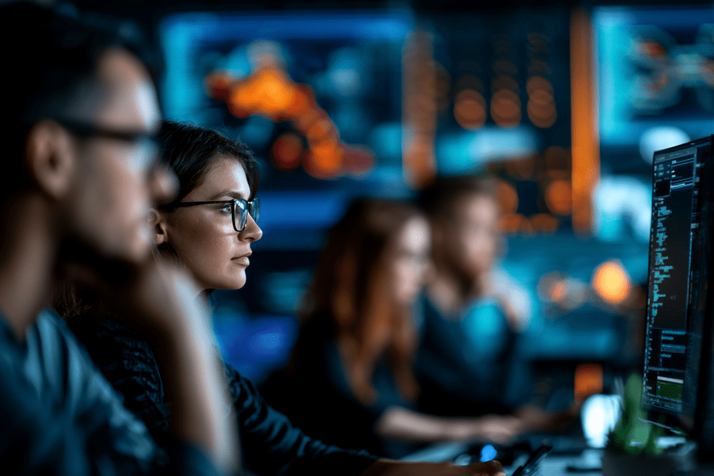 African IT security professionals monitoring Microsoft security dashboards to strengthen cyber resilience and business continuity